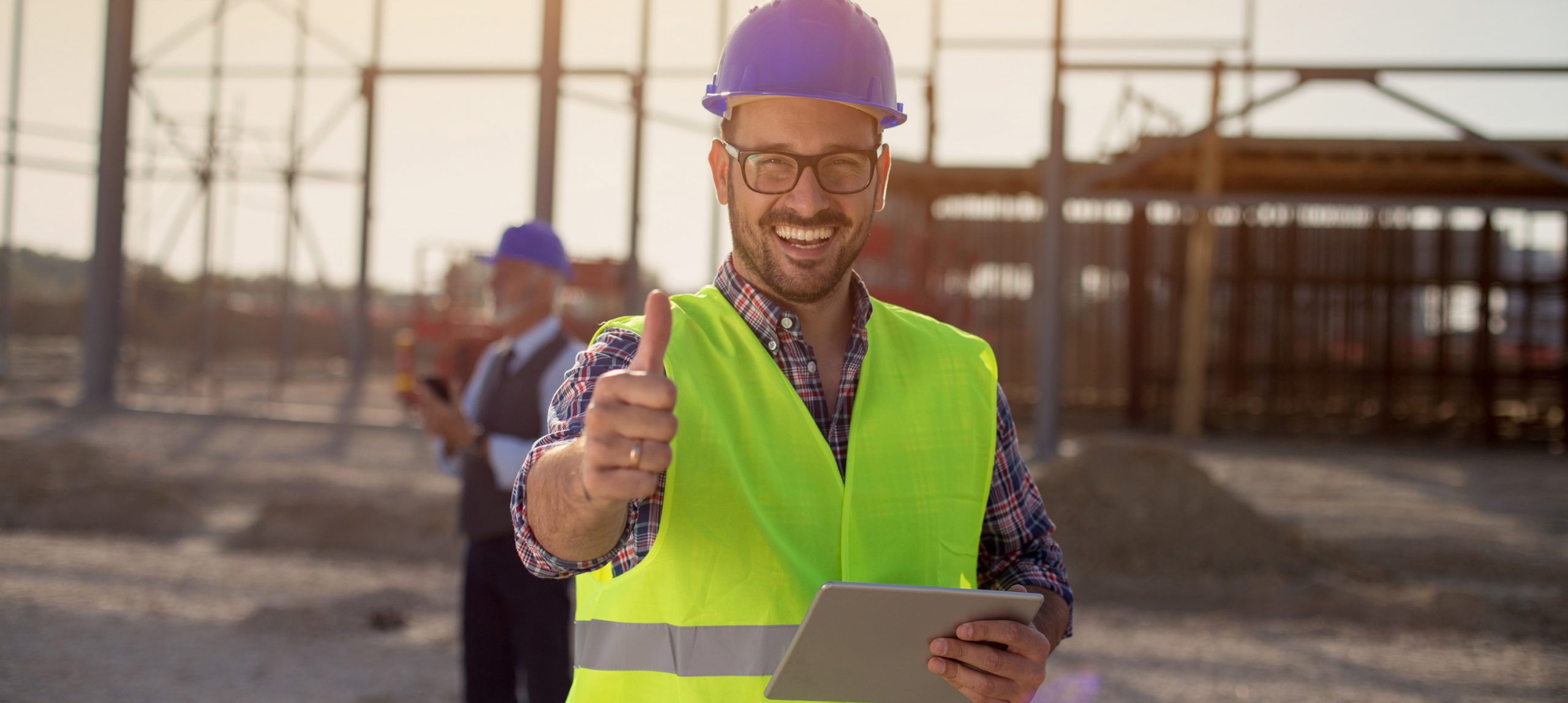 Happy construction worker giving a thumbs up